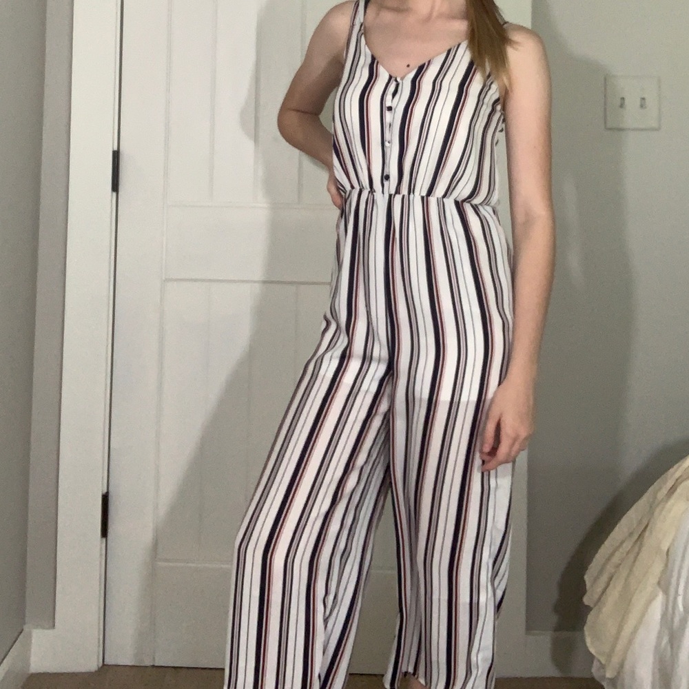 white, blue, and red striped jumpsuit